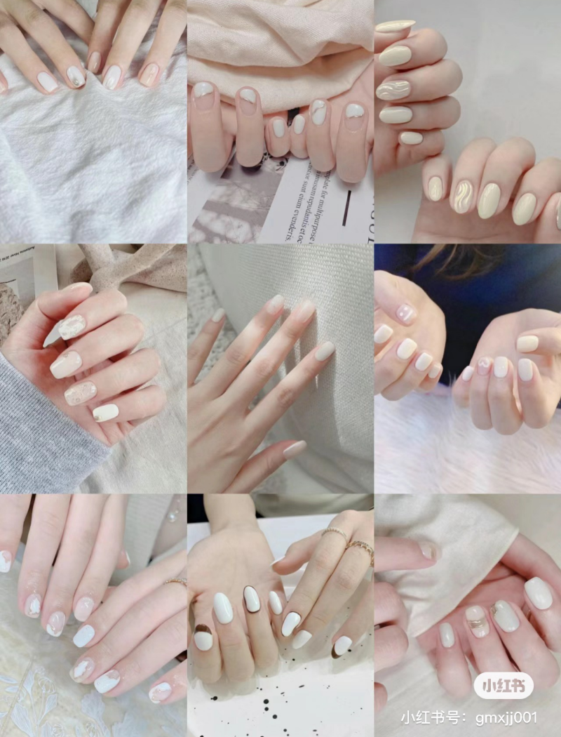 Bộ sưu tập các mẫu móng tay sơn màu trắng với nhiều kiểu trang trí khác nhau, chụp cận cảnh.