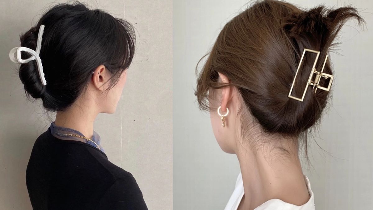 Hai người với kiểu tóc búi, kẹp tóc màu trắng và vàng, nền tường xám và trắng.