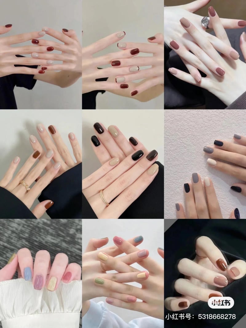 mau-nail-don-gian-cardina__100__d9a80c15dd7740c3a0ef7c427ca679b8 Bàn tay với nhiều kiểu sơn móng tay khác nhau, từ màu trơn đến kết hợp nhiều màu và họa tiết, kèm nhẫn.