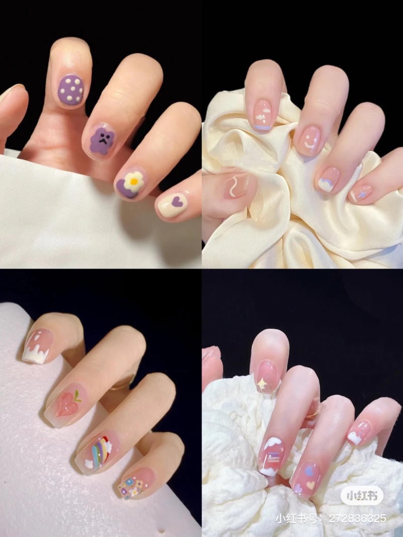 mau-nail-don-gian-cardina__134__2e5a0f0cae764933adb8d31bf3b0df70 Bàn tay với móng tay được trang trí đa dạng, nhiều màu sắc và họa tiết khác nhau, nền màu đen.