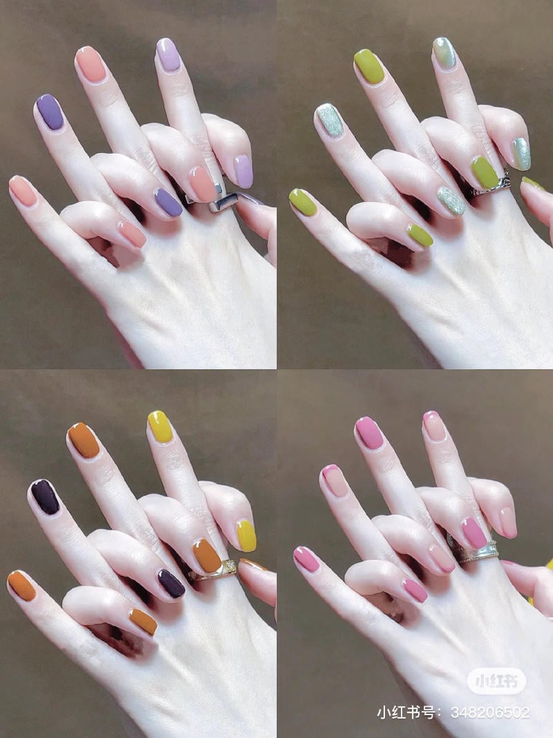 mau-nail-don-gian-cardina__33__333a394f10404567bed0ad610862c325 Bàn tay với nhiều mẫu sơn móng tay đa dạng màu sắc, từ tông trầm đến tông sáng, tạo phong cách nổi bật.