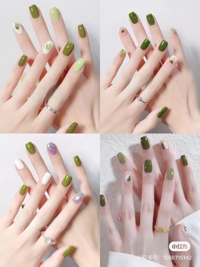 mau-nail-don-gian-cardina__65__d02edbf8bfed441d8a750c74e260fd1c Bàn tay với móng tay sơn màu xanh lá cây và họa tiết trang trí khác nhau, đeo nhẫn bạc và vàng.