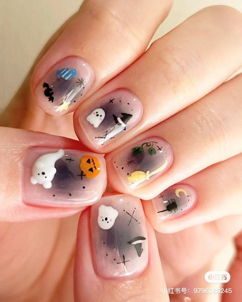 mau-nail-halloween-dep__27__87a424fca4c44206be42e399ad9e1819 Bộ móng tay trang trí họa tiết Halloween với hình bí ngô, ma, mũ phù thủy và các biểu tượng khác trên nền trong suốt.