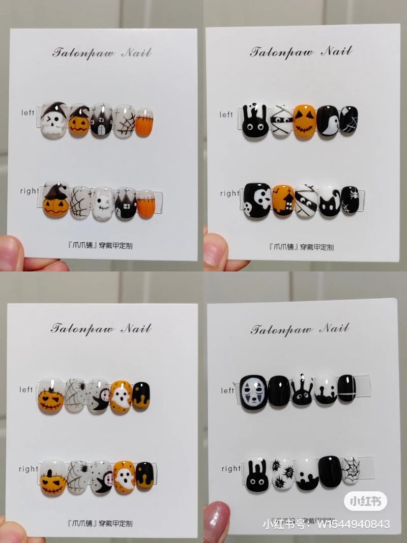 mau-nail-halloween-dep__71__51791f15420c4e43ad41bfd6a3c9f807 Bộ móng giả với họa tiết Halloween đa dạng, gồm bí ngô, nhện và mặt nạ, trên nền đen, trắng và cam.