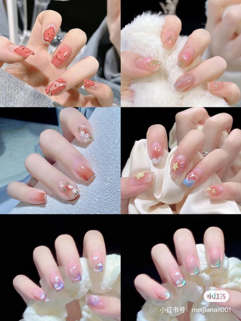 Bộ sưu tập móng tay với nhiều kiểu trang trí khác nhau, gồm họa tiết hoa, trái tim và màu sắc đa dạng.