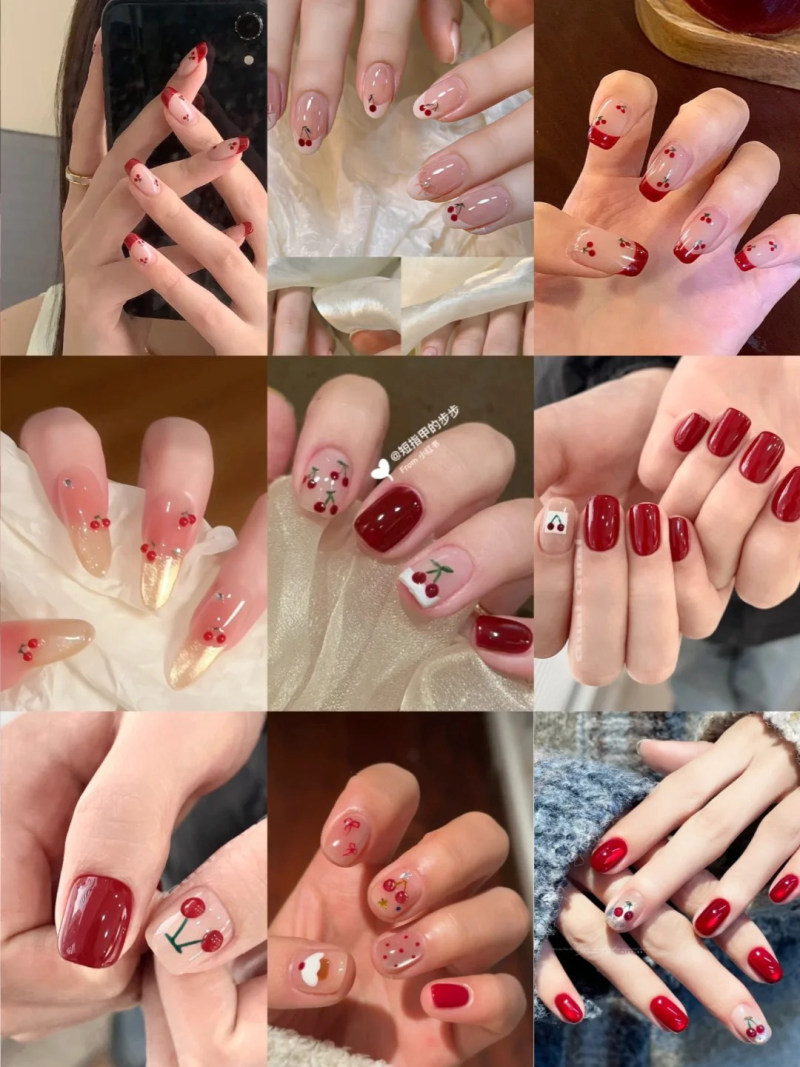 Bộ sưu tập móng tay với nhiều mẫu thiết kế khác nhau, chủ yếu là màu đỏ và họa tiết quả anh đào.