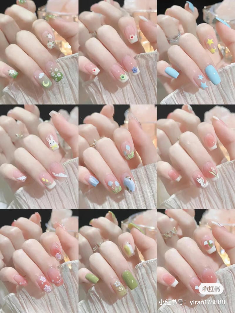 Bộ sưu tập ảnh móng tay với nhiều thiết kế và màu sắc khác nhau, bao gồm họa tiết hoa, sao và động vật.