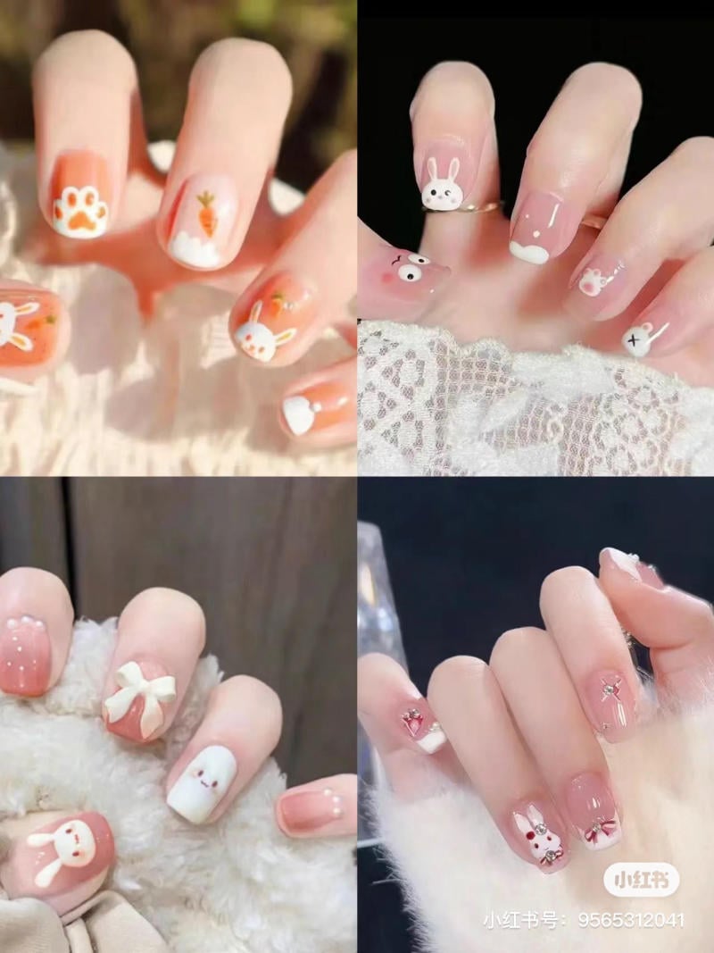 Bộ sưu tập móng tay trang trí họa tiết động vật và nơ nhỏ đáng yêu trên nền màu hồng nhạt.