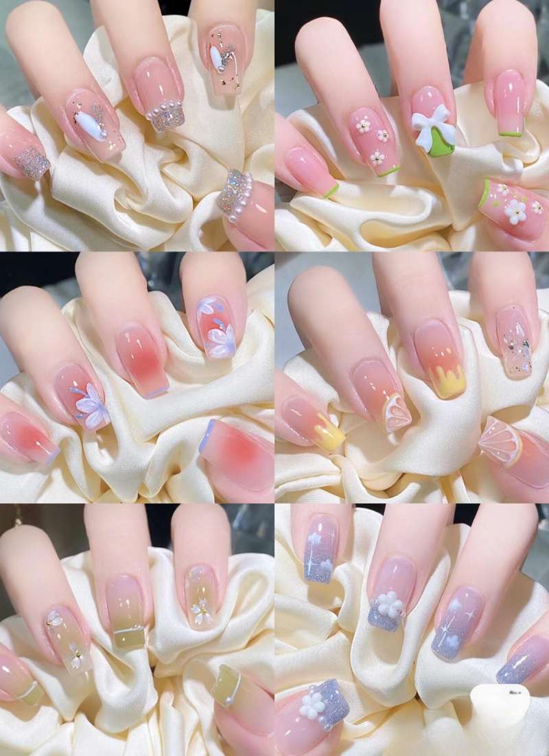 Bộ sưu tập nail nghệ thuật với đa dạng hoa văn và màu sắc trên nền móng tay, mỗi mẫu có thiết kế riêng biệt.