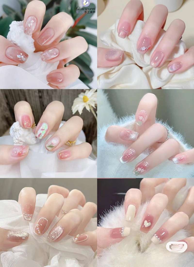 Bộ sưu tập móng tay với các thiết kế nghệ thuật, màu sắc và họa tiết đa dạng trên nền màu hồng và trắng.