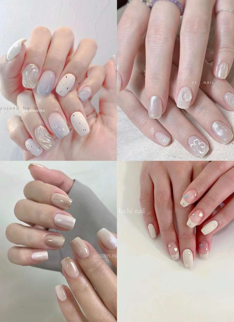 Bốn hình ảnh móng tay với các kiểu sơn nghệ thuật khác nhau, chủ yếu là màu trắng và nhạt.
