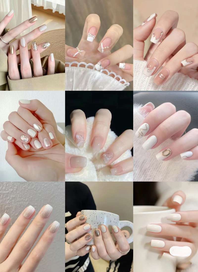 Bộ sưu tập các mẫu móng tay với thiết kế đa dạng, màu sắc chủ đạo là trắng và vàng, có đính đá trang trí.