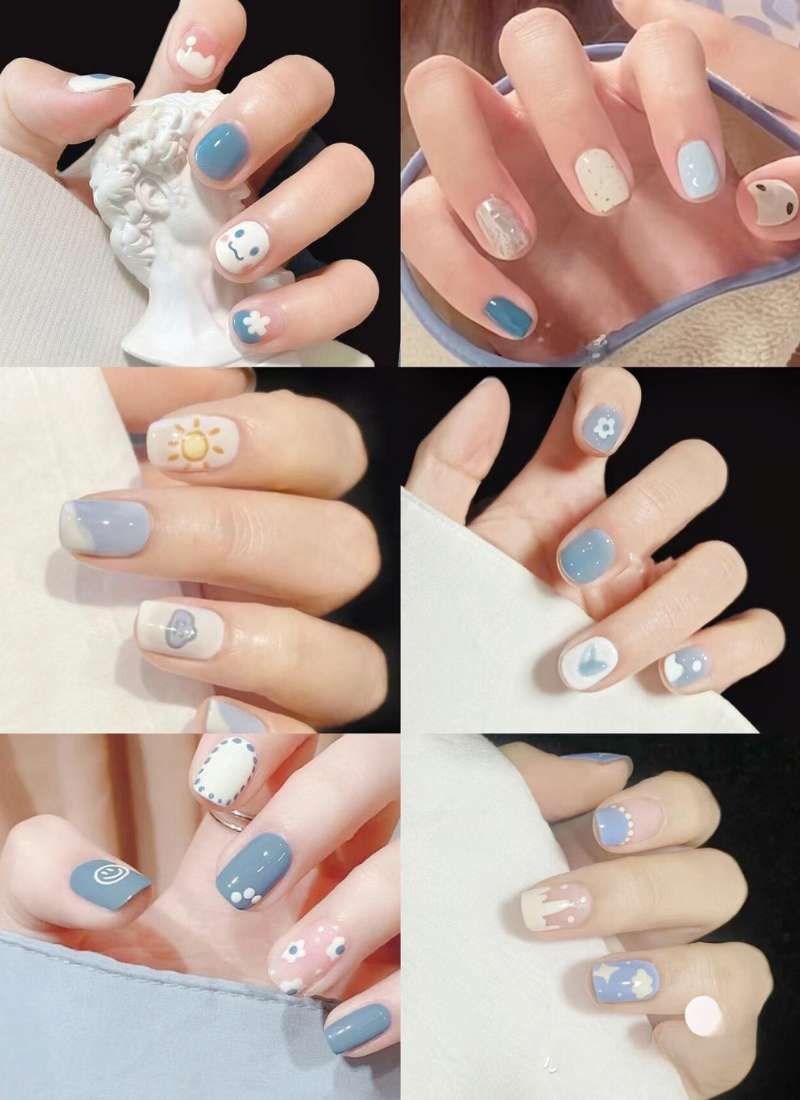 Bàn tay với móng tay được sơn nhiều màu sắc, họa tiết đa dạng và trang trí tỉ mỉ, tạo nên phong cách nghệ thuật.