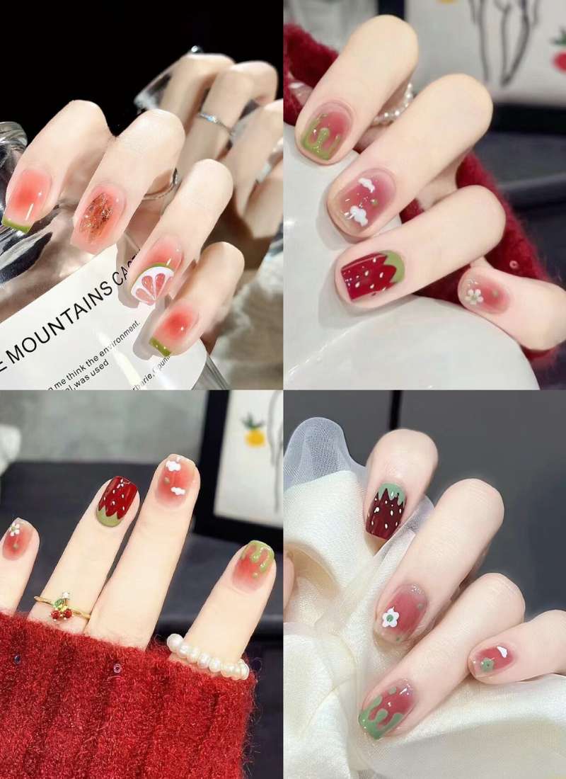 Bộ sưu tập móng tay với họa tiết trái cây và hoa trên nền đỏ, xanh và hồng, tạo cảm giác tươi mới và sáng tạo.