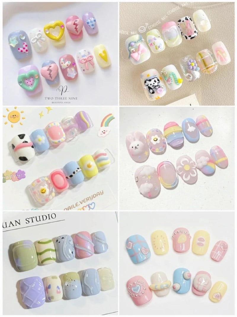 Bộ sưu tập móng tay giả với nhiều kiểu trang trí và màu sắc pastel khác nhau, bao gồm họa tiết trái tim và động vật.