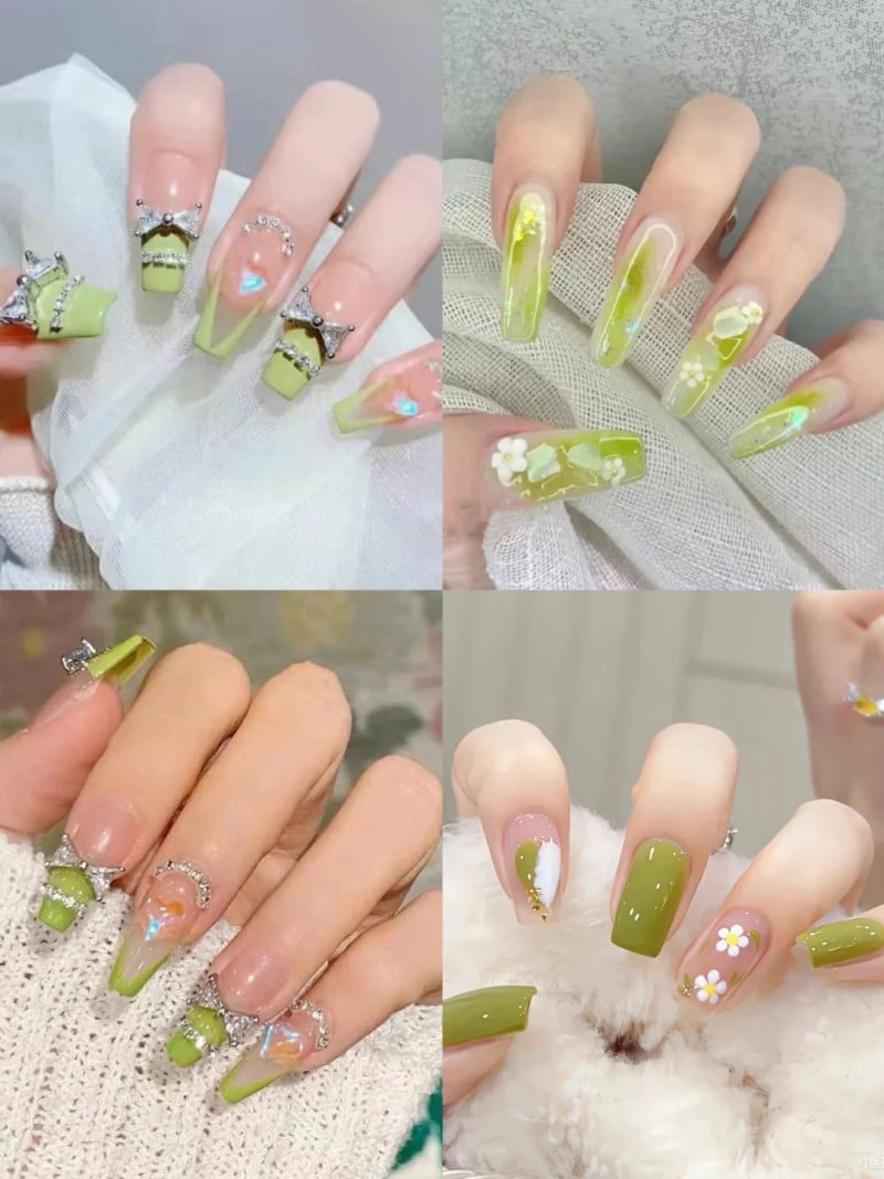 Bộ móng tay được trang trí với họa tiết và màu xanh lá cây, kết hợp các phụ kiện và họa tiết hoa khác nhau.