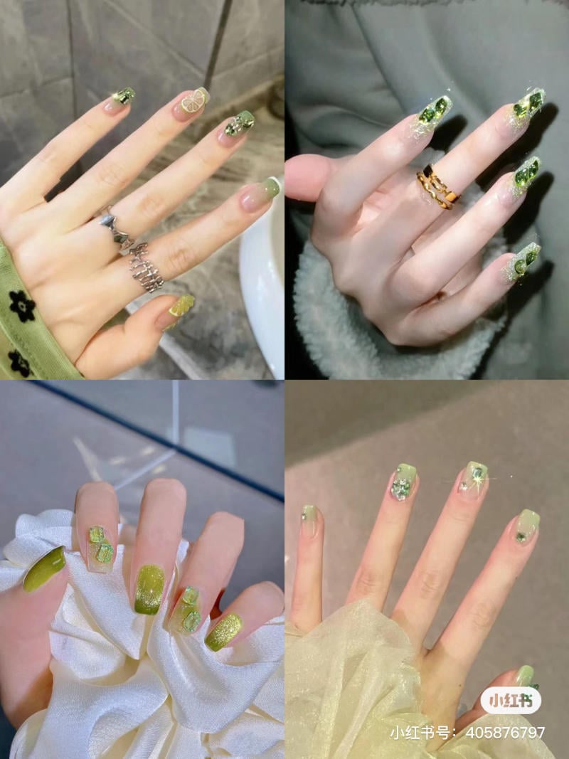 Bộ móng tay với nhiều mẫu trang trí màu xanh lá, kèm phụ kiện và họa tiết trang trí khác nhau trên nền màu sáng.