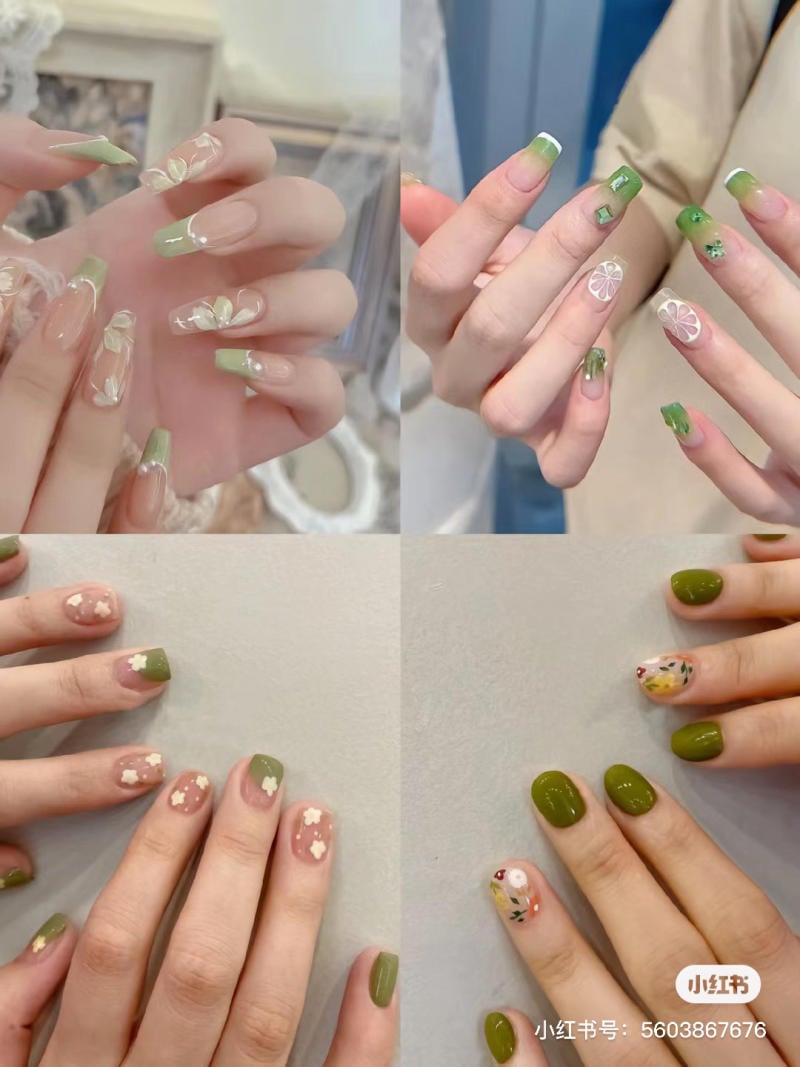 Bộ móng tay với các thiết kế nghệ thuật khác nhau, chủ yếu là màu xanh lá và họa tiết hoa.