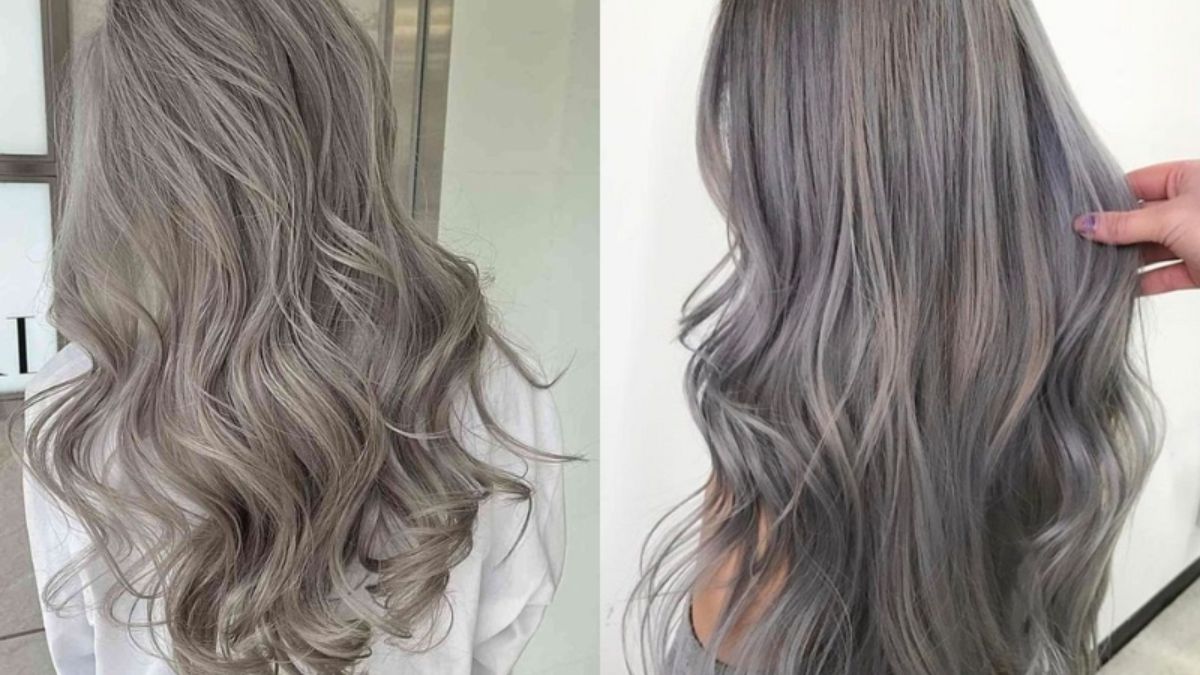 Hai kiểu tóc dài màu xám bạc, uốn lượn sóng nhẹ, chụp từ phía sau trong không gian nội thất.