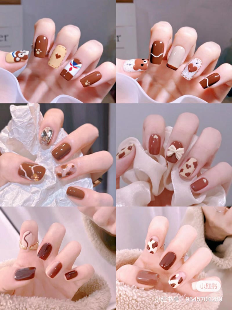 Bộ móng tay với thiết kế đa dạng, sử dụng tông màu nâu và họa tiết thú vị, trên nền sáng.