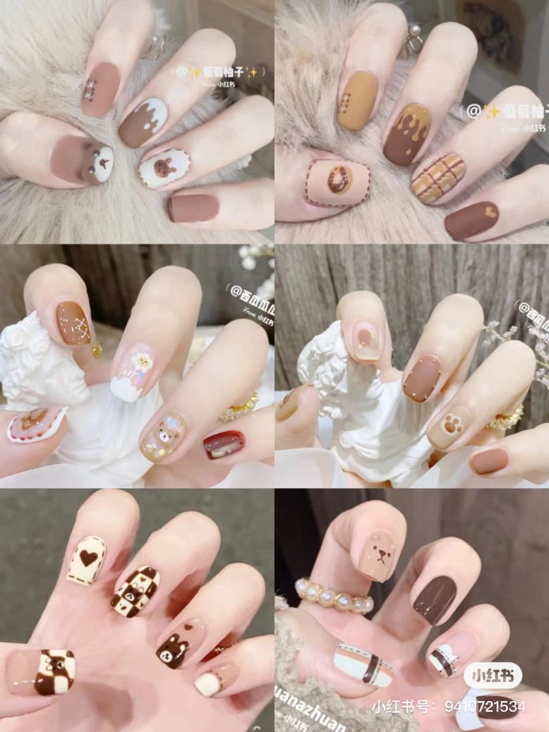 Bộ sưu tập móng tay với họa tiết gấu và màu nâu, trắng, vàng, kết hợp trang trí đa dạng và sáng tạo.