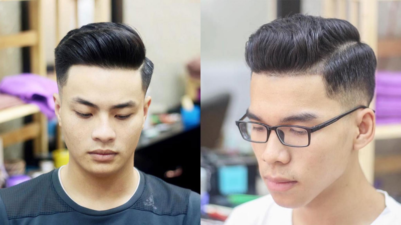 Top 30 Kiểu Tóc Nam Đẹp & Cá Tính 2025: Xu Hướng Nổi Bật 11 Hai người đàn ông với kiểu tóc undercut, một người đeo kính, trong không gian nội thất tiệm cắt tóc.