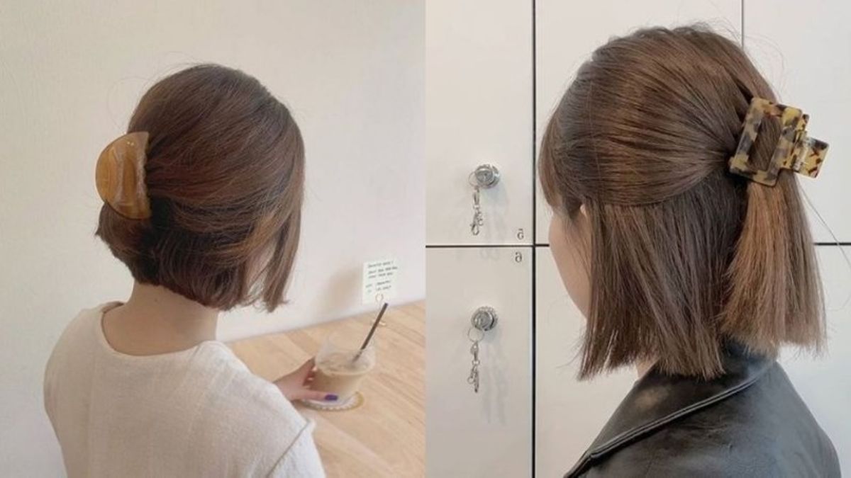 Hai người có tóc ngắn, kẹp tóc lớn, một người cầm ly nước, người kia đứng trước tủ khóa.
