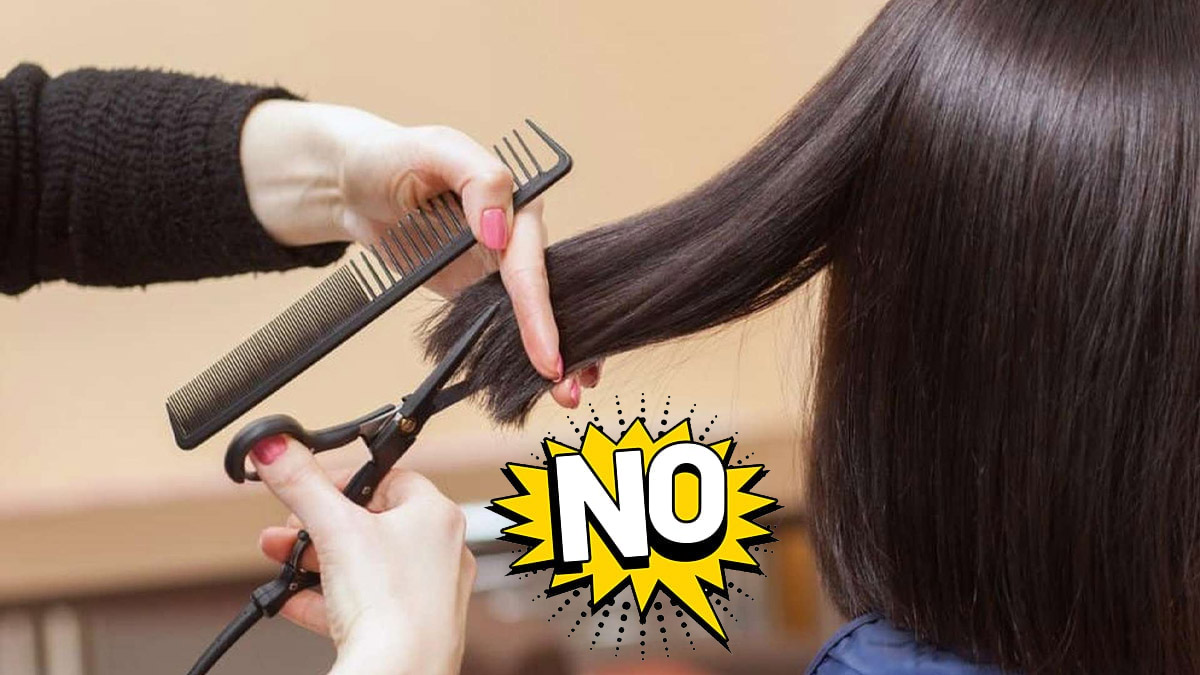 Người đang cắt tóc bằng kéo và lược, có chữ "NO" nổi bật trên hình.