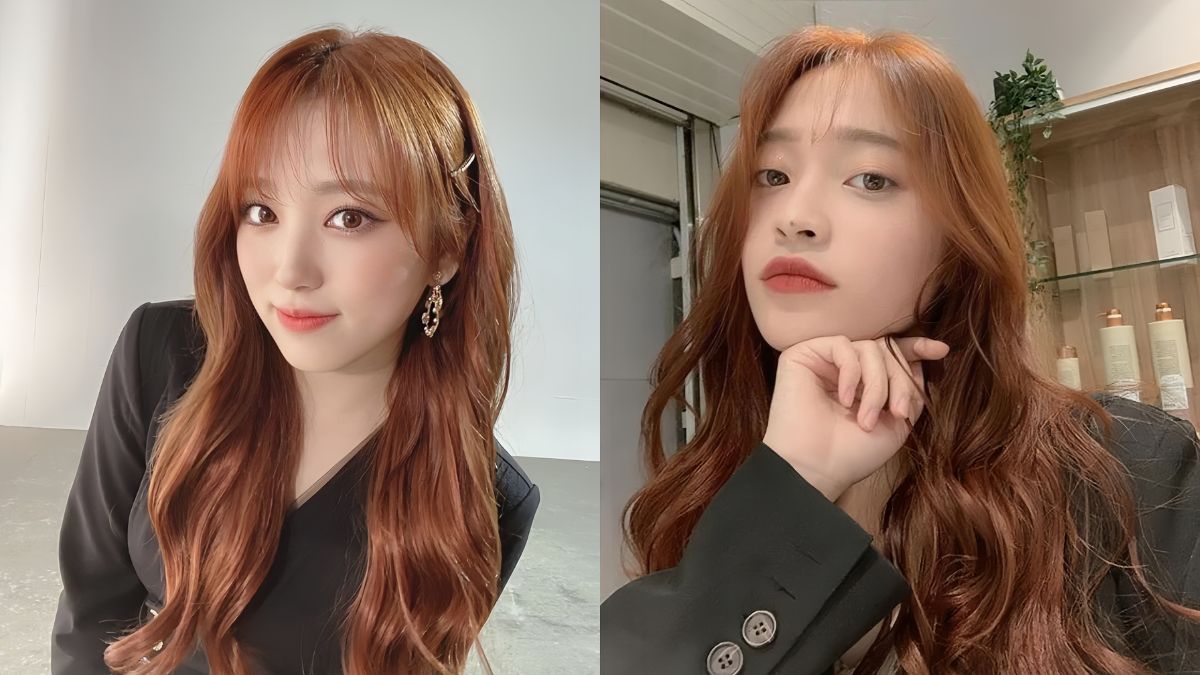 Hai người chụp ảnh ch&acirc;n dung, t&oacute;c d&agrave;i m&agrave;u n&acirc;u đỏ, mặc trang phục m&agrave;u tối, biểu cảm tự nhi&ecirc;n.