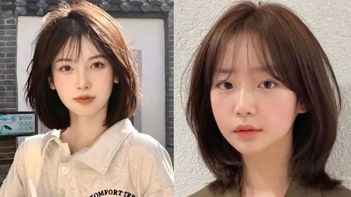 Hai người với kiểu tóc ngắn, nhìn vào máy ảnh, nền gạch và tường sáng.