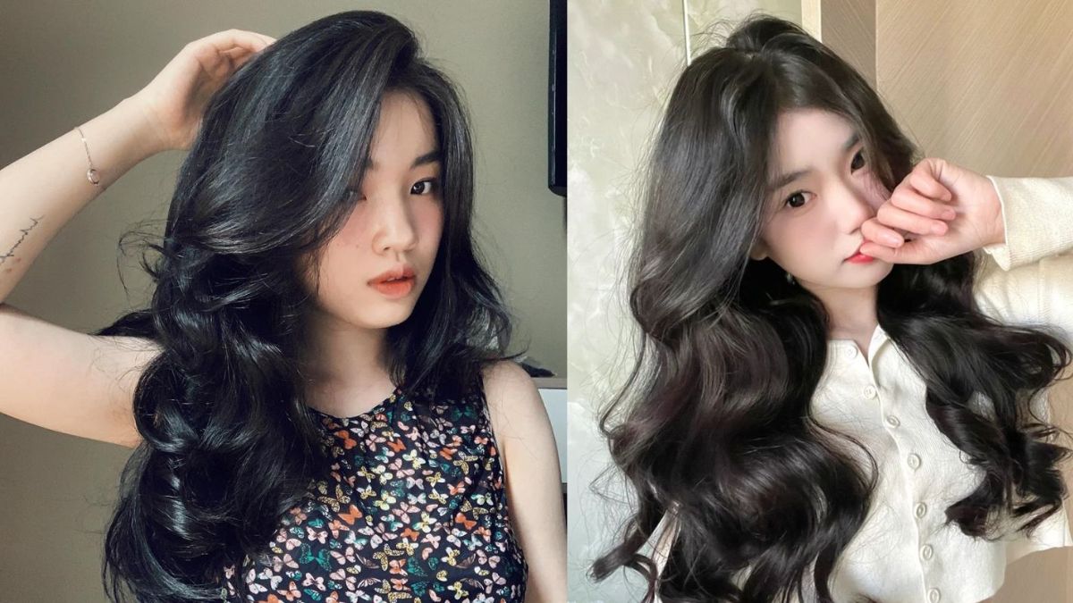 Hai người với mái tóc dài, xoăn tự nhiên, mặc trang phục khác nhau, tạo dáng chụp ảnh trong nhà.