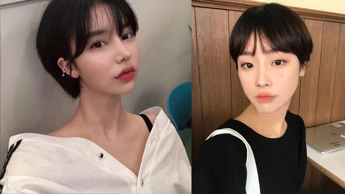 Hai người với mái tóc ngắn, một người mặc áo trắng, người kia mặc áo đen, chụp ảnh selfie trong nhà.