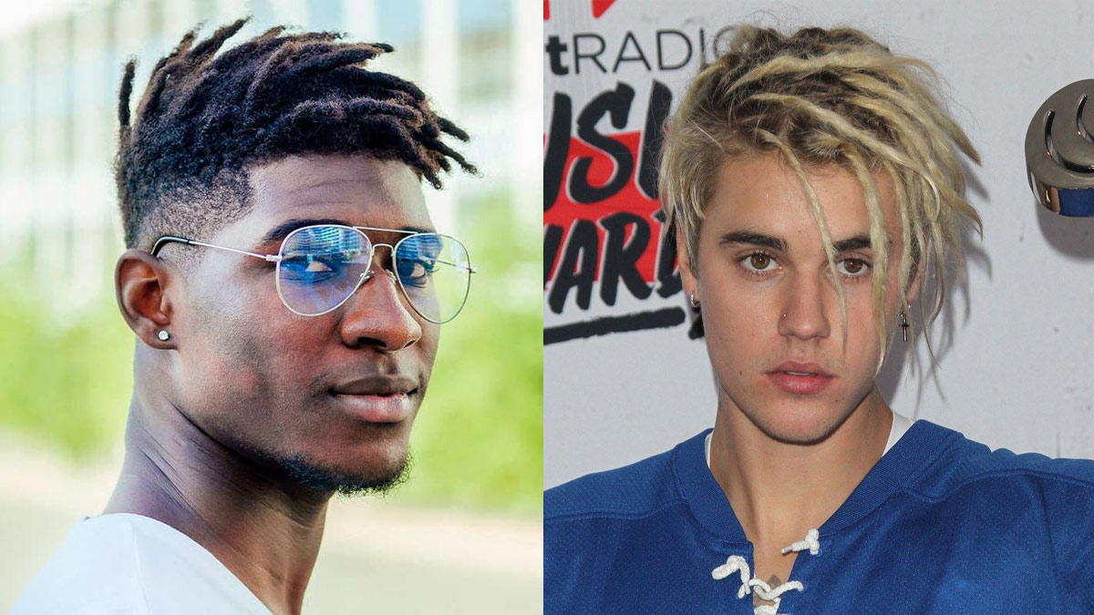 Hai người đàn ông với kiểu tóc dreadlocks khác nhau, một người đeo kính, một người mặc áo xanh.