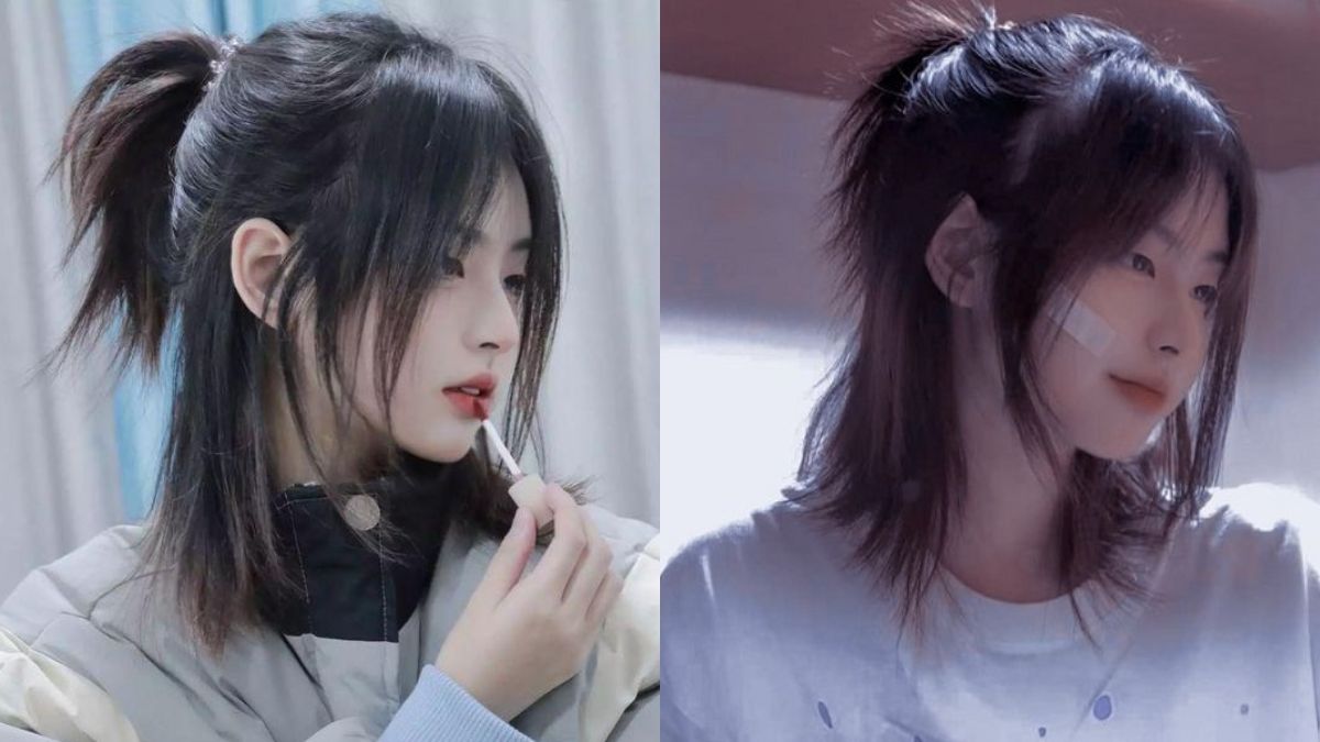 Hai người trẻ tóc đen, một người đang thoa son, người kia có băng dán trên mặt, ánh sáng dịu nhẹ.