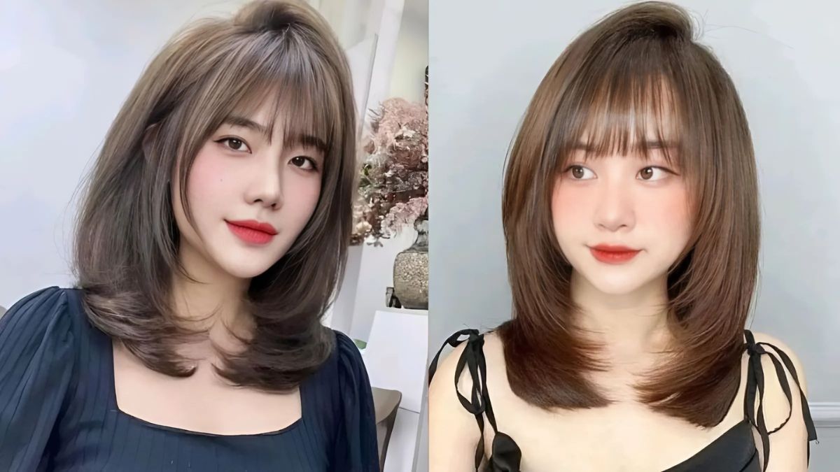 Hai người mẫu với kiểu tóc ngang vai và mái bằng, mặc trang phục tối màu trong phòng sáng.